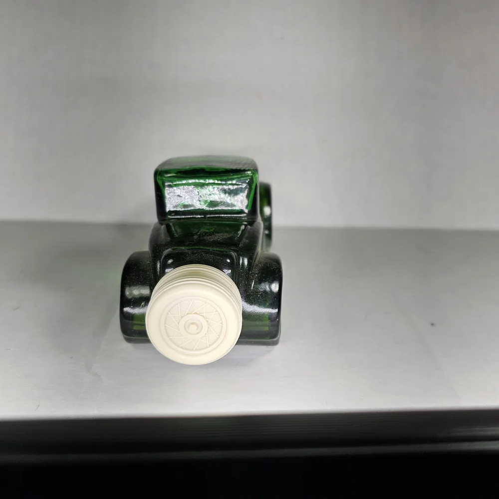 Avon Sterling Six II Green Glass Car Bottle
